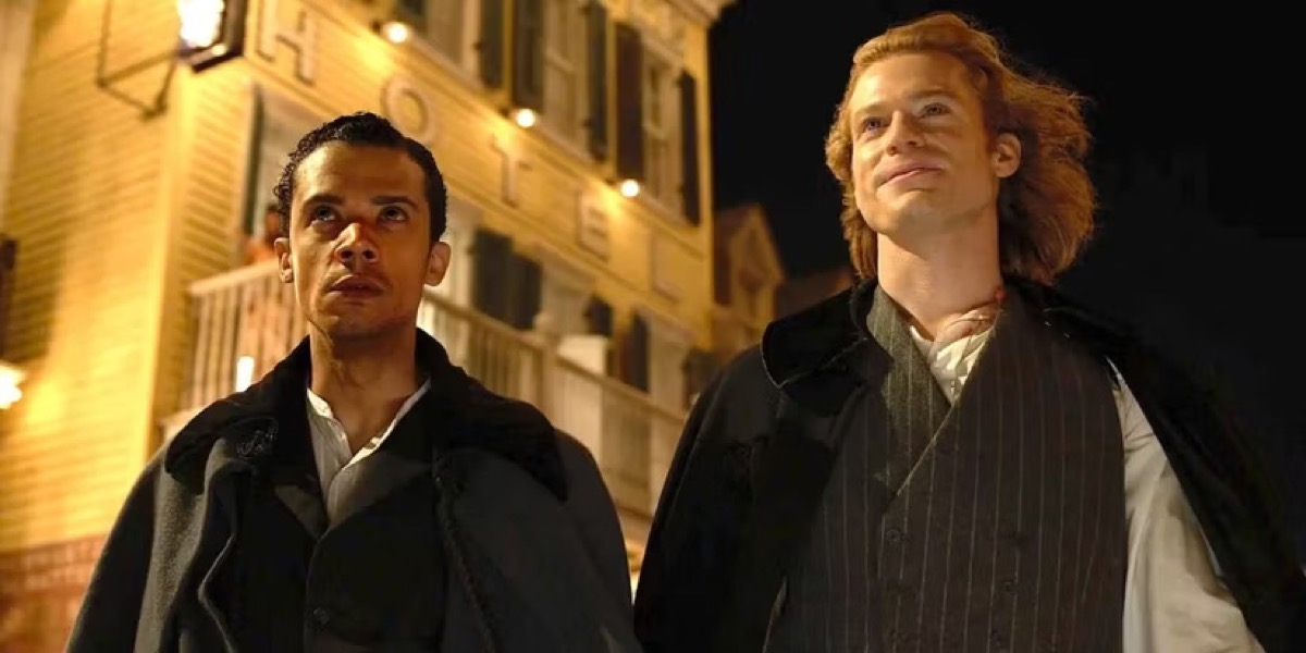 Two young men walk down the street at night in "Interview with The Vampire" 