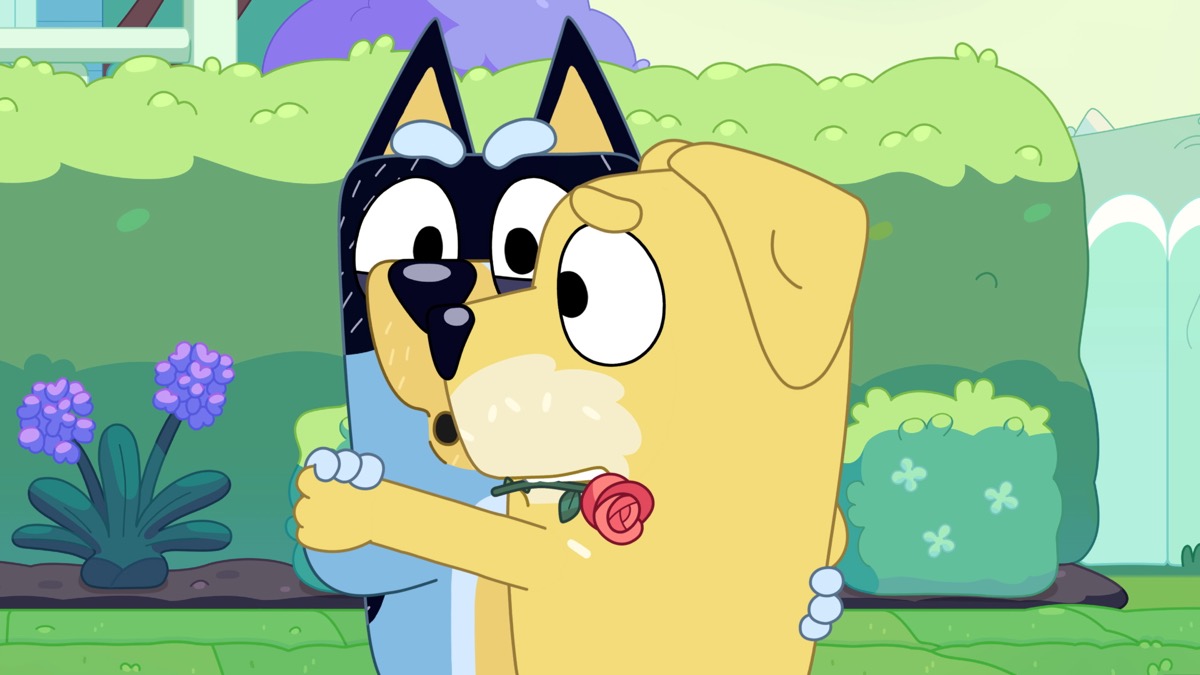 Two animated dogs waltz, one with a rose in its teeth in "Bluey" 