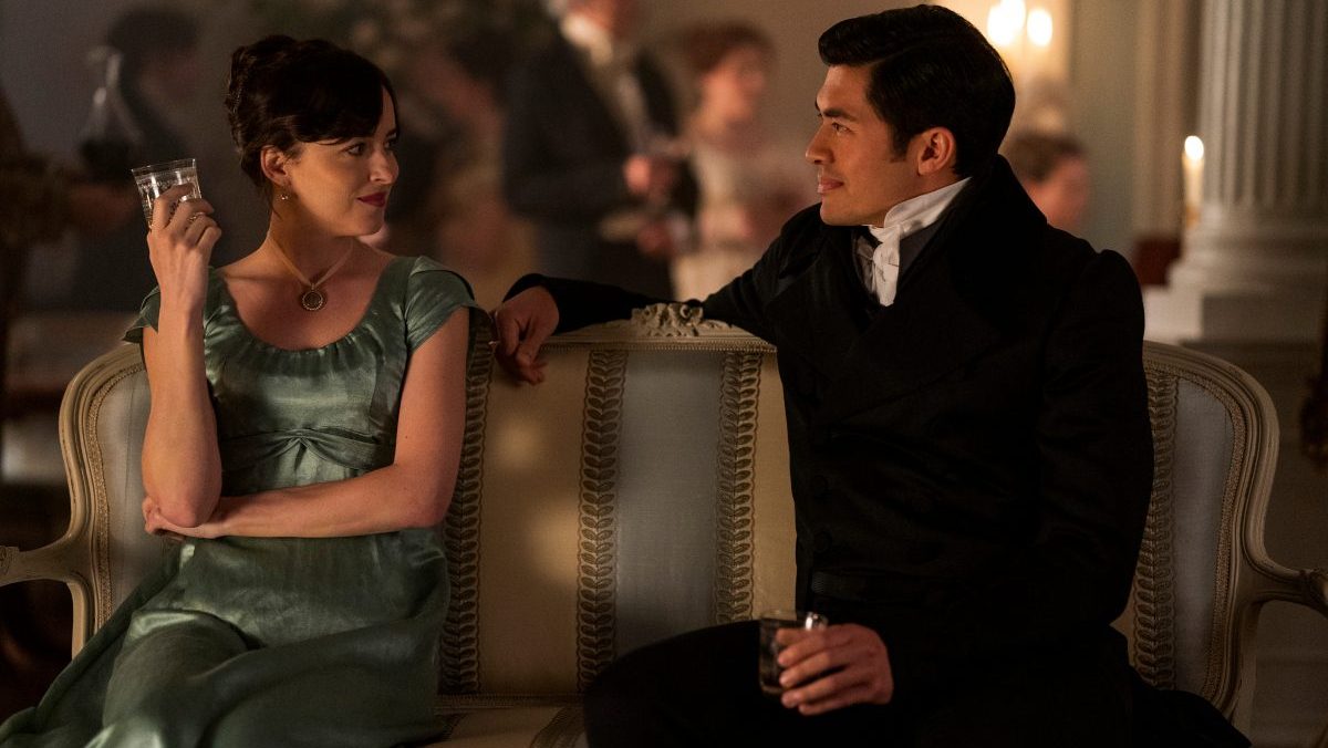 Persuasion. (L to R) Dakota Johnson as Anne Elliot, Henry Golding as Mr. Elliot in Persuasion. Cr. Nick Wall/Netflix © 2022