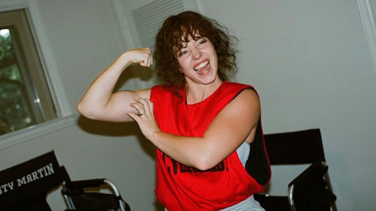 Sydney Sweeney flexing in a cut off shirt for her new movie