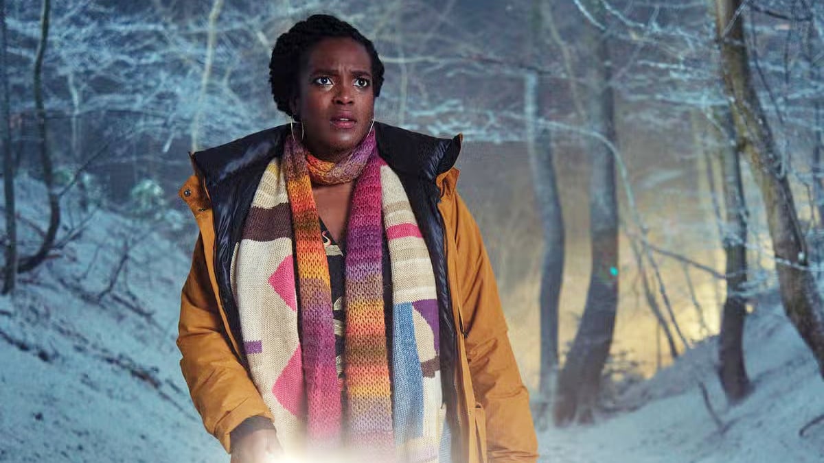 Wunmi Mosaku as Riya Ajunwa in ITV and Britbox's 'Passenger,' standing in a snow-covered forest