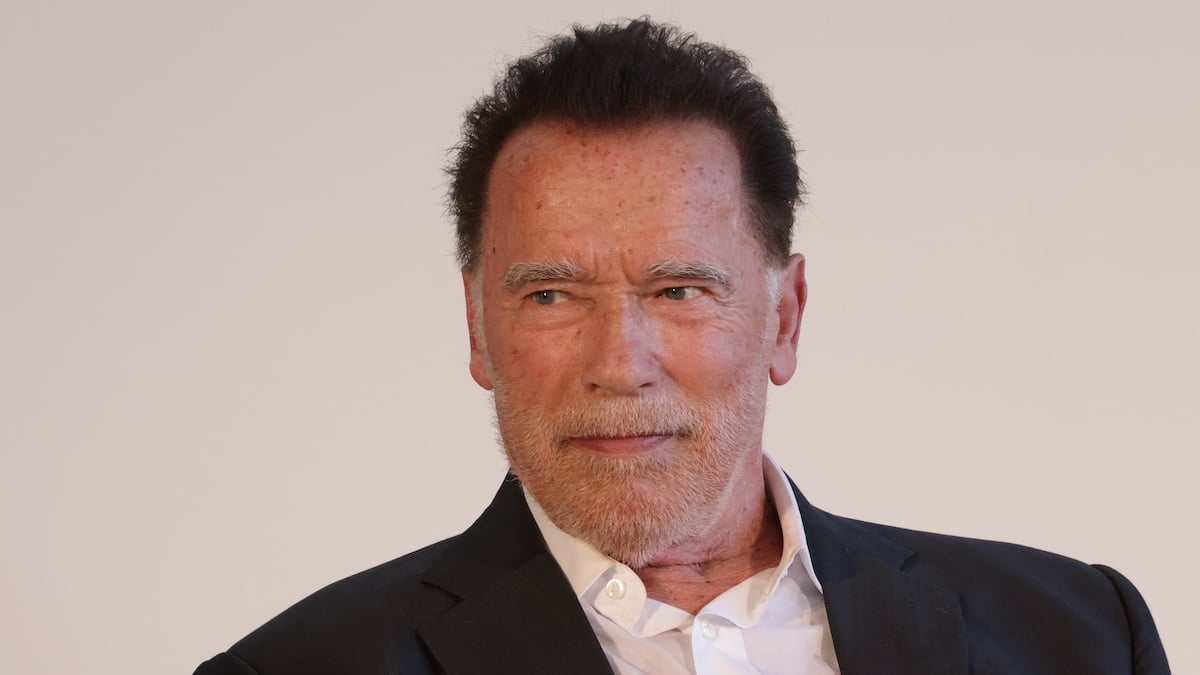 Arnold Schwarzenegger sitting