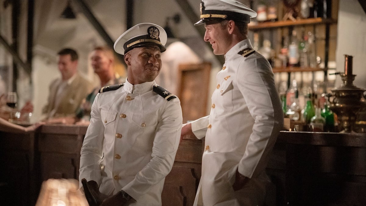 two navy aviators standing next to each other