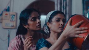 Kani Kusruti as Prabha and Divya Prabha as Anu examine a rice cooker in All We Imagine As Light