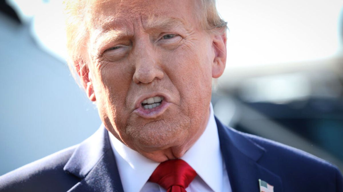 DETROIT, MICHIGAN - OCTOBER 18: Republican presidential nominee, former U.S. President Donald Trump, addresses the media as he arrives at Detroit Metropolitan Wayne County Airport on October 18, 2024, in Detroit, Michigan. There are 17 days remaining until the U.S. presidential election, which will take place on Tuesday, November 5, 2024. (Photo by Win McNamee/Getty Images)