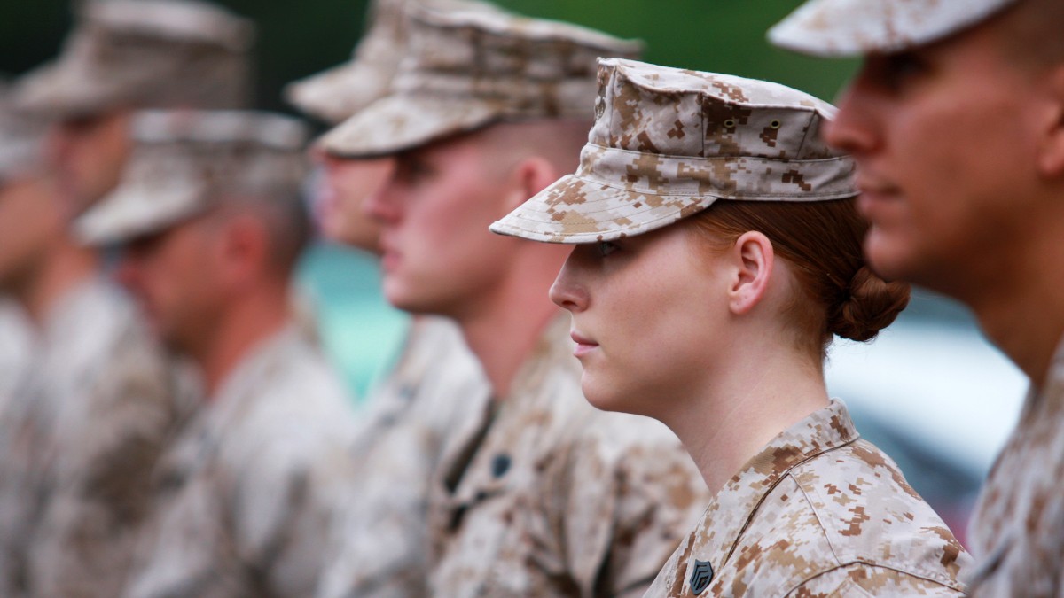 A female marine in a formation of marines