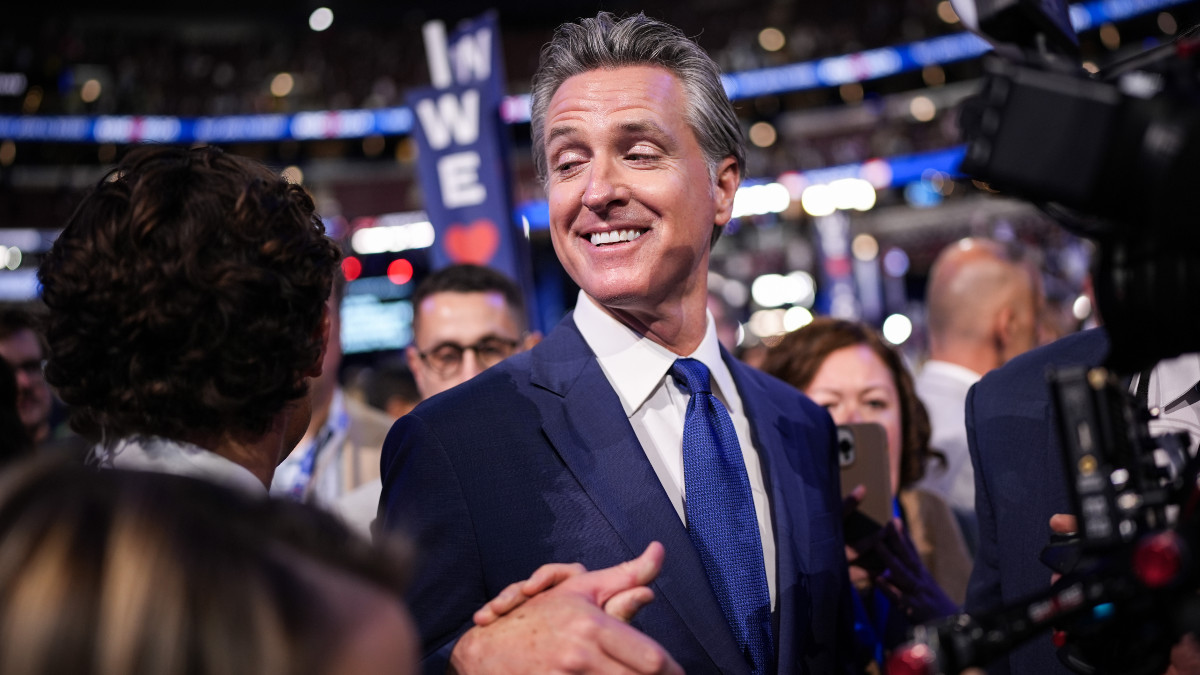 CHICAGO, ILLINOIS - AUGUST 19: California Governor Gavin Newsom greets people during the first day of the Democratic National Convention at the United Center on August 19, 2024 in Chicago, Illinois. Delegates, politicians, and Democratic party supporters are in Chicago for the convention, concluding with current Vice President Kamala Harris accepting her party's presidential nomination. The DNC takes place from August 19-22. (Photo by Andrew Harnik/Getty Images)