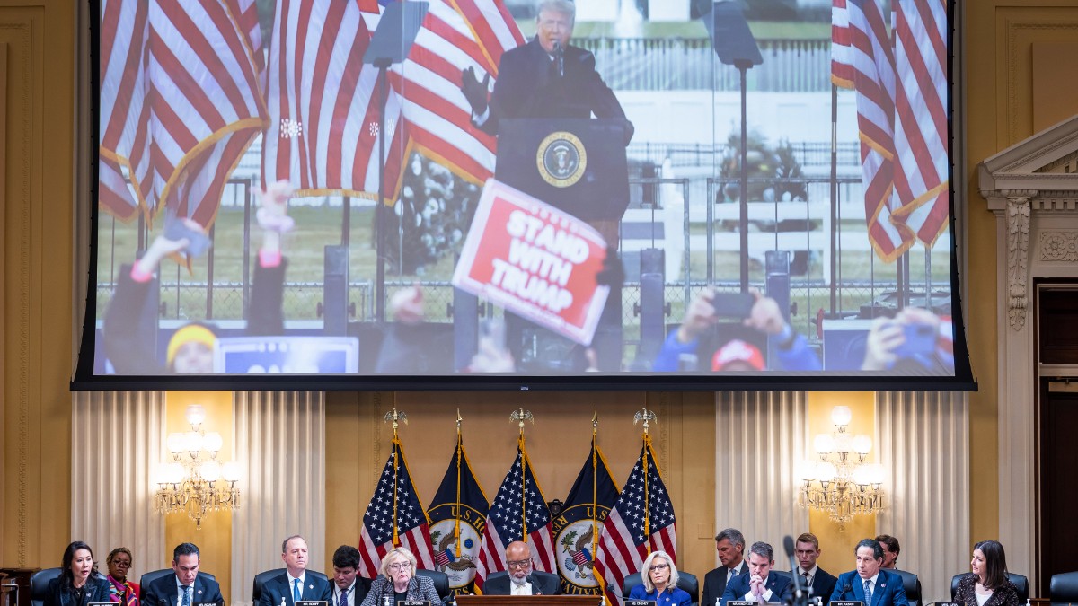 An image of Trump is displayed during a House Select Committee to Investigate the January 6 Attack meeting