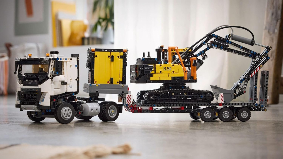 A promotional image for the LEGO Technic Volvo FMX Truck & EC230 Electric Excavator