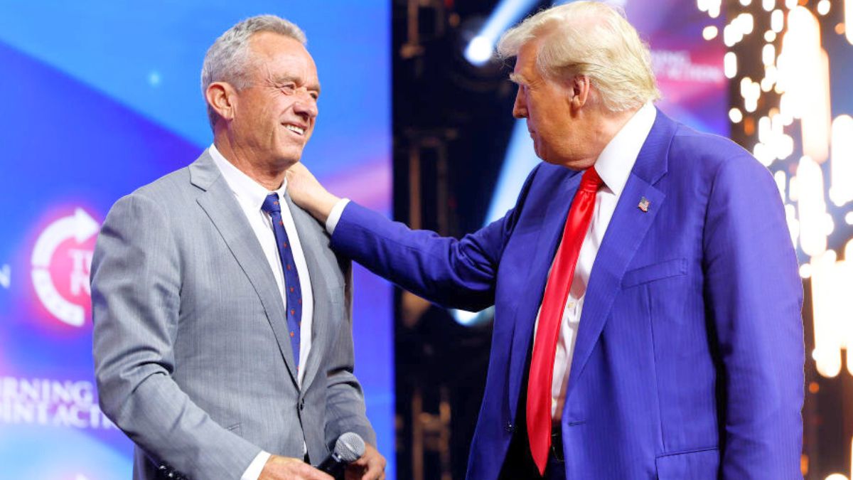 DULUTH, GEORGIA - OCTOBER 23: Republican presidential nominee, former U.S. President Donald Trump welcomes Robert F. Kennedy Jr. to the stage at a Turning Point Action campaign rally at the Gas South Arena on October 23, 2024 in Duluth, Georgia. Trump is campaigning across Georgia today as he and Democratic presidential nominee, U.S. Vice President Kamala Harris attempt to win over swing state voters. (Photo by Anna Moneymaker/Getty Images)