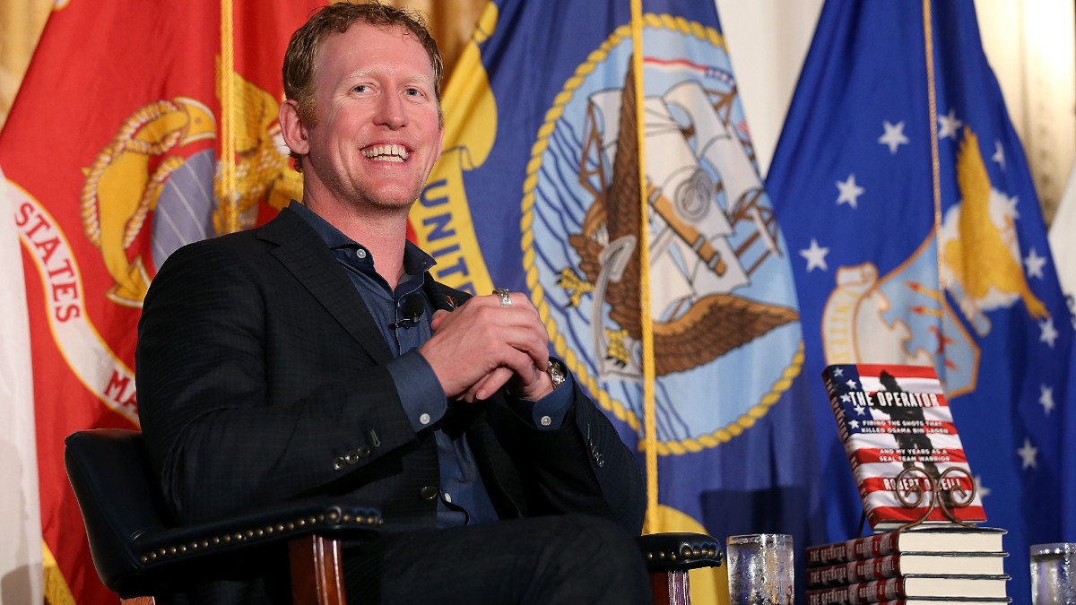 Robert O'Neill sitting at a book signing at Richard Nixon Library