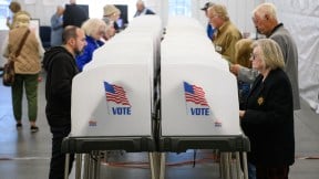 HENDERSONVILLE, NORTH CAROLINA - OCTOBER 17: Voters make selections at their voting booths inside an early voting site on October 17, 2024 in Hendersonville, North Carolina. Several counties effected by Hurricane Helene saw a large turnout of residents for the first day of early voting in Western North Carolina. (Photo by Melissa Sue Gerrits/Getty Images)