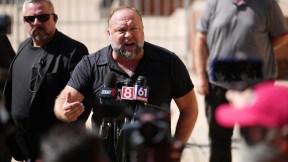 Angry Alex Jones at a mic