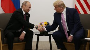 donald trump shaking hands with putin