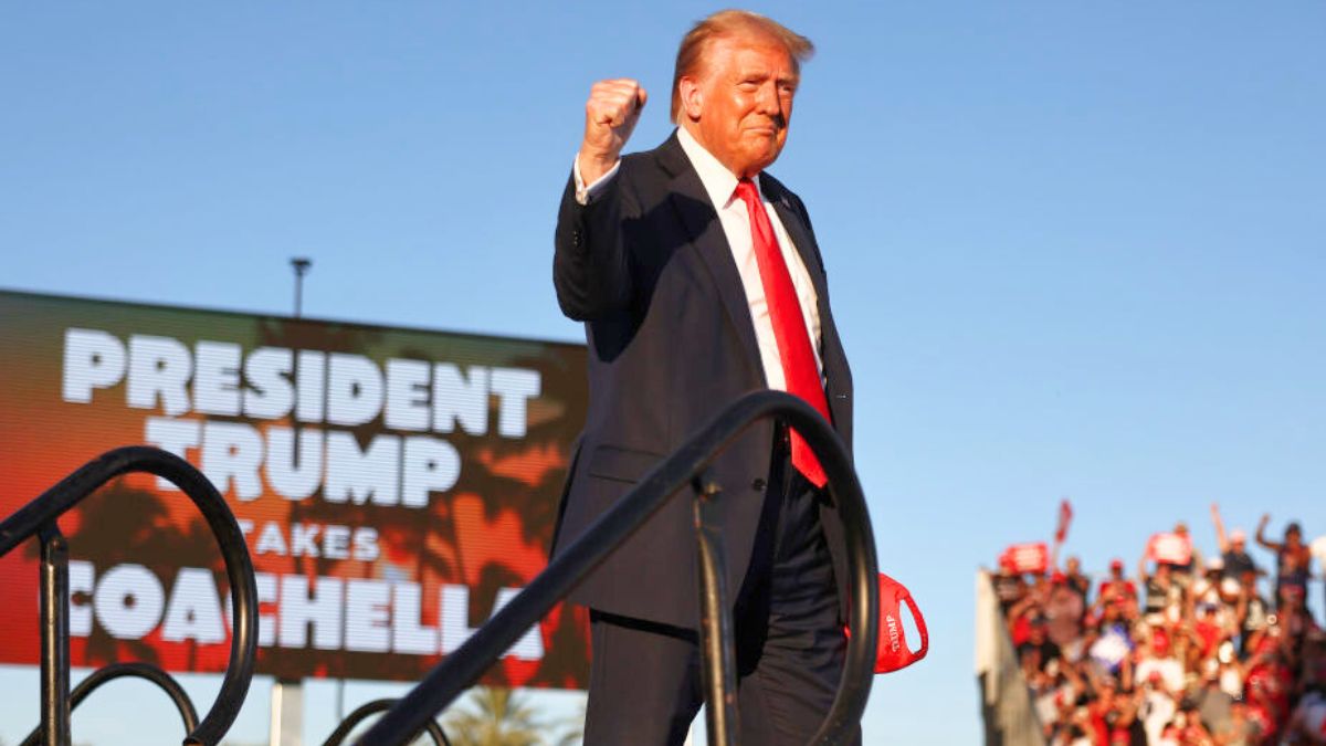 COACHELLA, CALIFORNIA - OCTOBER 12: Republican presidential nominee, former U.S. President Donald Trump gestures while walking onstage for a campaign rally on October 12, 2024 in Coachella, California. With 24 days to go until election day, former President Donald Trump is detouring from swing states to hold the rally in Democratic presidential nominee, Vice President Kamala Harris' home state. (Photo by Mario Tama/Getty Images)