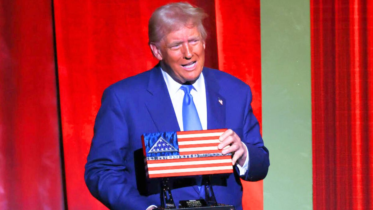 GREENVALE, NEW YORK - DECEMBER 05: U.S. President-elect Donald Trump holds an award during the FOX Nation's Patriot Awards at the Tilles Center on December 05, 2024 in Greenvale, New York. President-elect Trump was in attendance for the Patriot awards where he was the recipient of the “Patriot of the Year" award. According to Fox the annual awards “honor and recognize America’s finest patriots, including military veterans, first responders and other inspirational everyday heroes." (Photo by Michael M. Santiago/Getty Images)