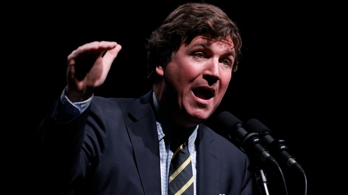 Tucker Carlson speaks at the Desert Diamond Arena during his tour