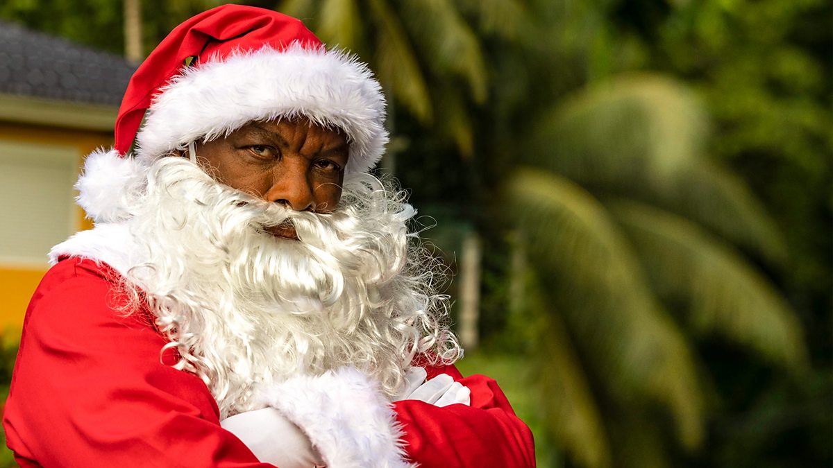 Don Warrington as Comissioner Patterson in the 2021 'Death in Paradise' Christmas special, wearing a Santa suit