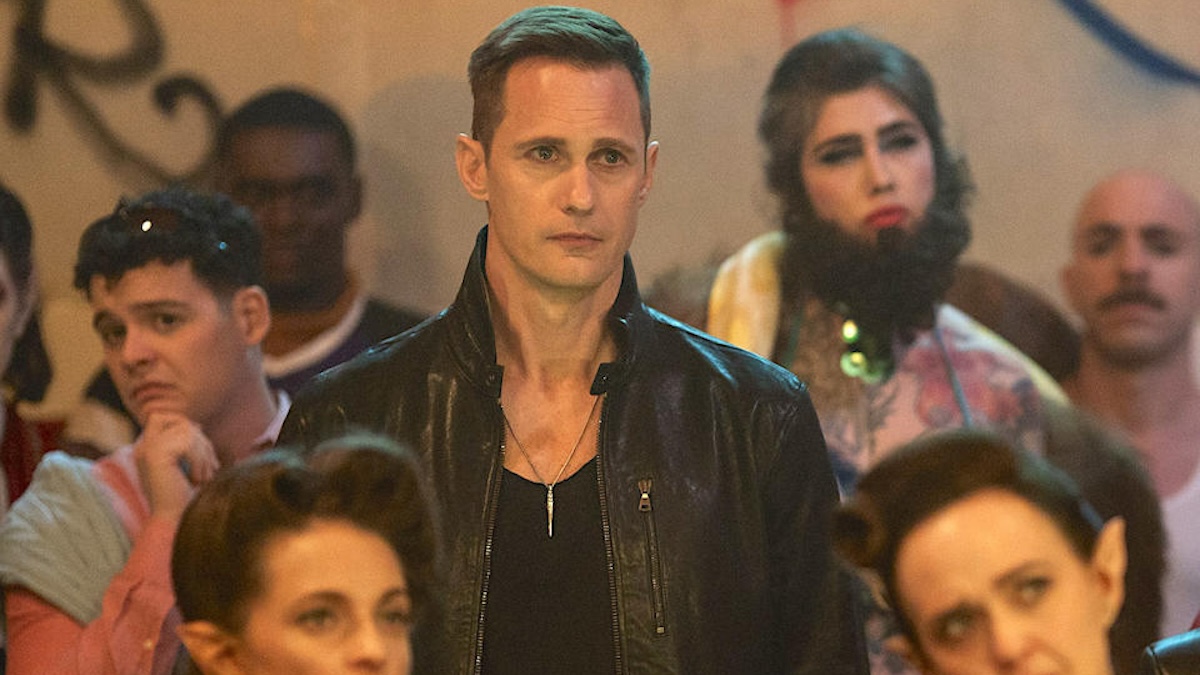 alexander skarsgard standing with people in what we do in the shadows