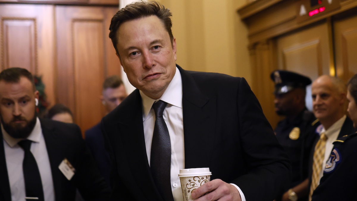 elon musk with a cup of coffee