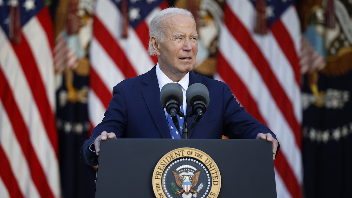 joe biden standing and giving a speech