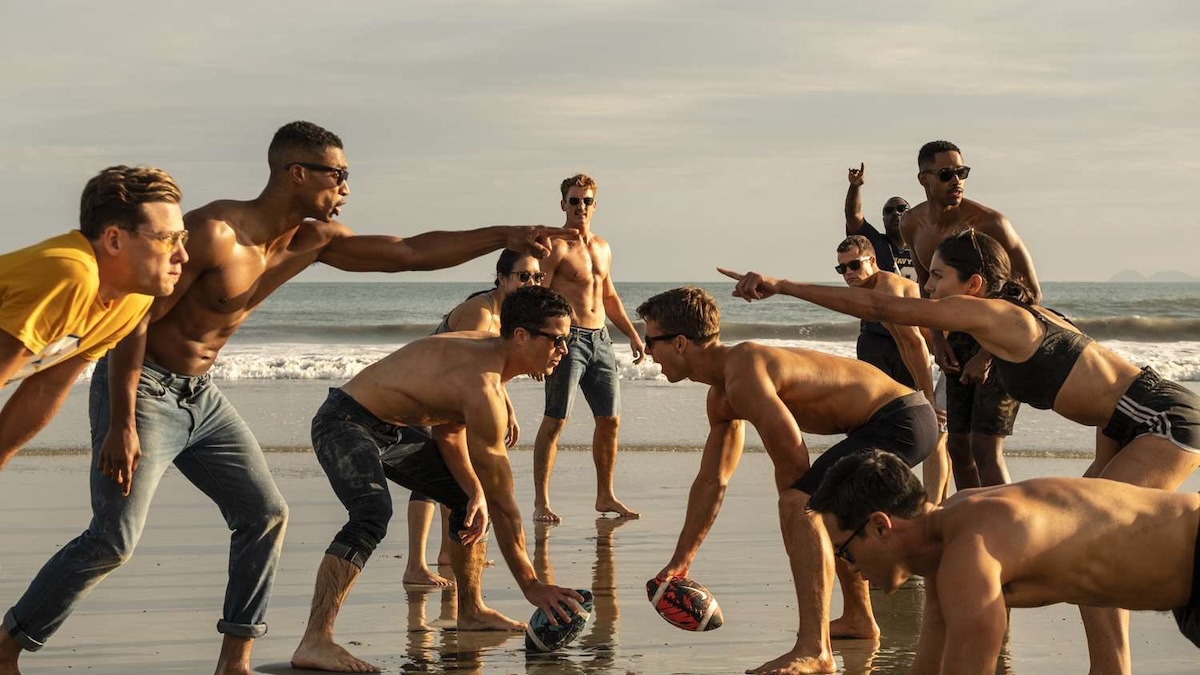 the cast of top gun maverick on the beach shirtless together