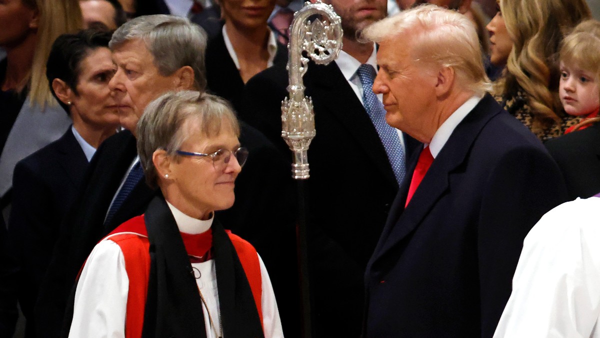 Bishop Mariann Budde arrives at the National Prayer Service as Donald Trump looks on