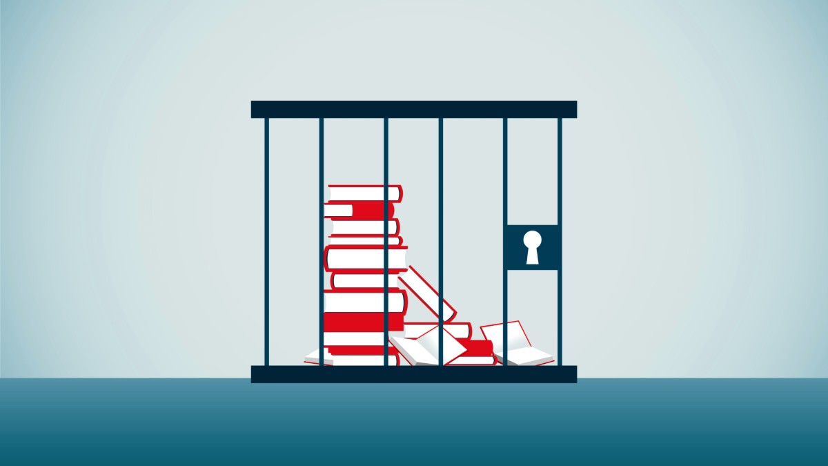 A stack of books locked in a cage