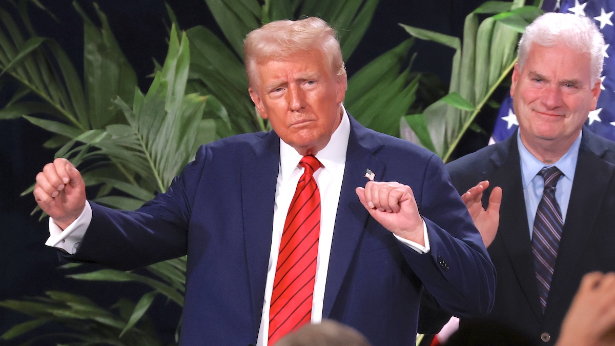 President Donald Trump dances as House Majority Whip Tom Emmer (R-MN) applauds following Trump's speech