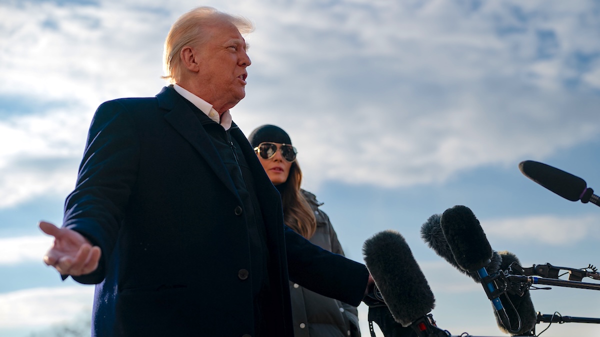 President Donald Trump speaks to members of the press as he and First Lady Melania Trump prepare to depart the White House aboard Marine One