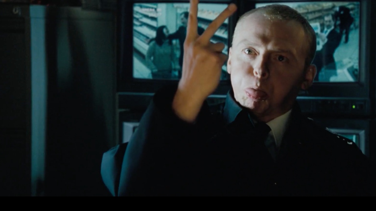 Simon Peg sticks up two fingers in famous "jog on" scene in Hot Fuzz