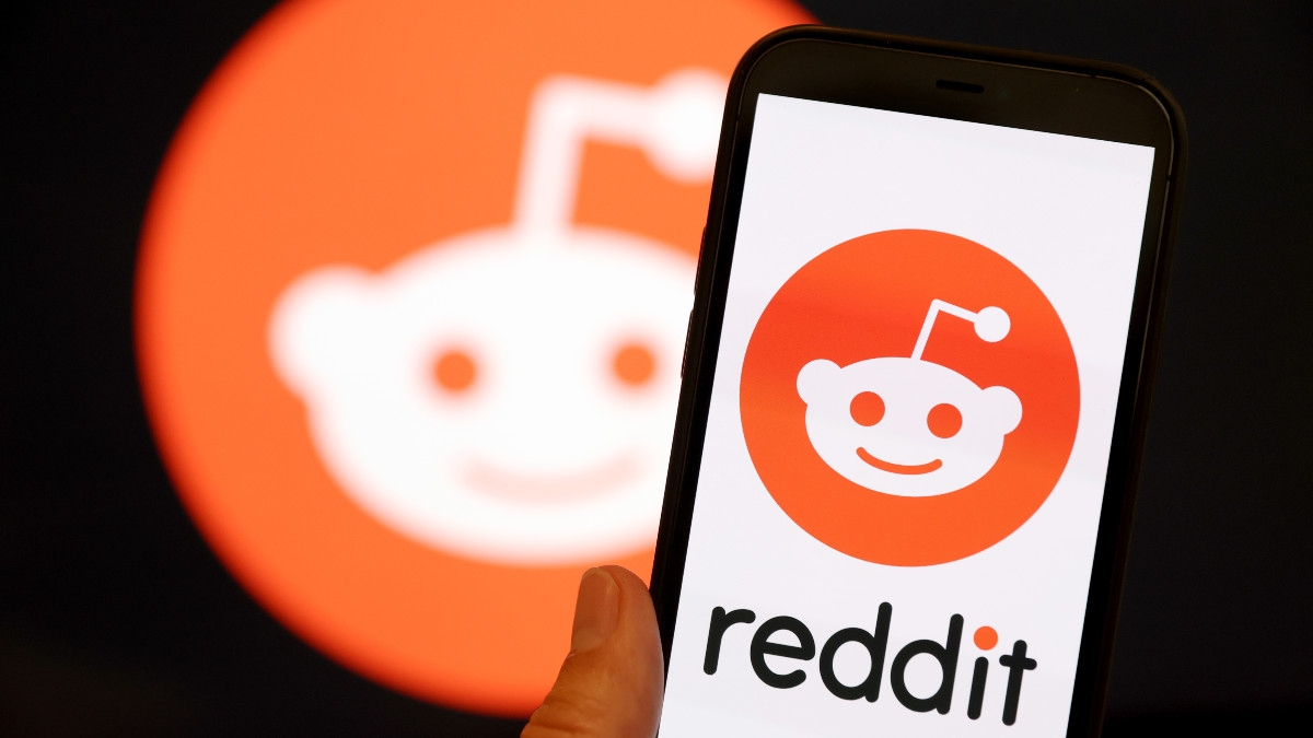 SAN ANSELMO, CALIFORNIA - DECEMBER 16: In this photo illustration, The Reddit logo is displayed on the screen of an iPhone on December 16, 2021 in San Anselmo, California. Reddit has confidentially filed paperwork for an initial public offering (IPO) with the Securities and Exchange Commission. (Photo Illustration by Justin Sullivan/Getty Images)