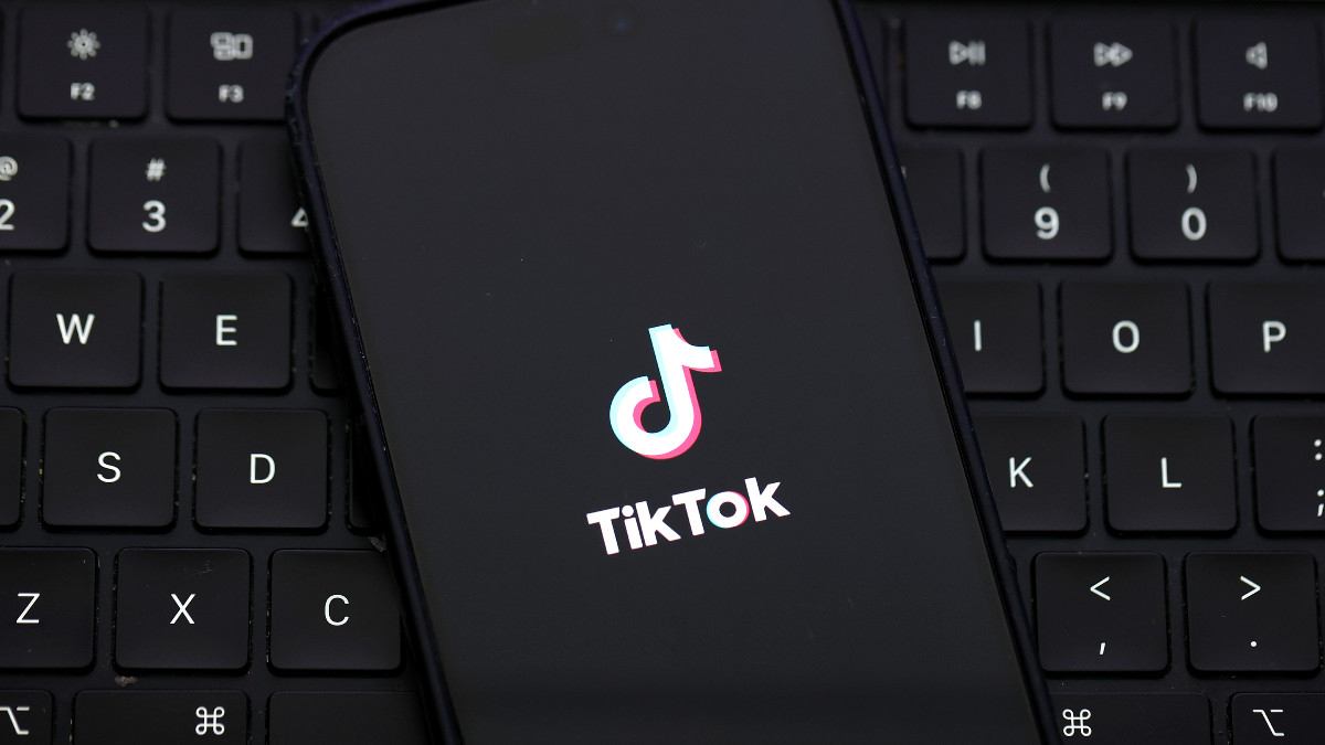 SAN ANSELMO, CALIFORNIA - DECEMBER 06: In this photo illustration, the TikTok logo is displayed on an iPhone screen on December 06, 2024 in San Anselmo, California. A three-judge panel of the U.S. Court of Appeals in Washington, D.C., has upheld a law mandating China-based ByteDance to sell the popular social media app TikTok or face a ban in the United States. ByteDance has until January 19, 2025 to sell the company. (Photo Illustration by Justin Sullivan/Getty Images)