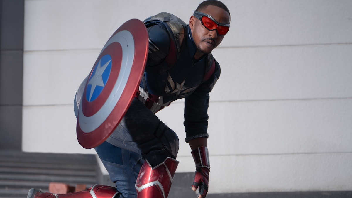 sam wilson with the shield bending down