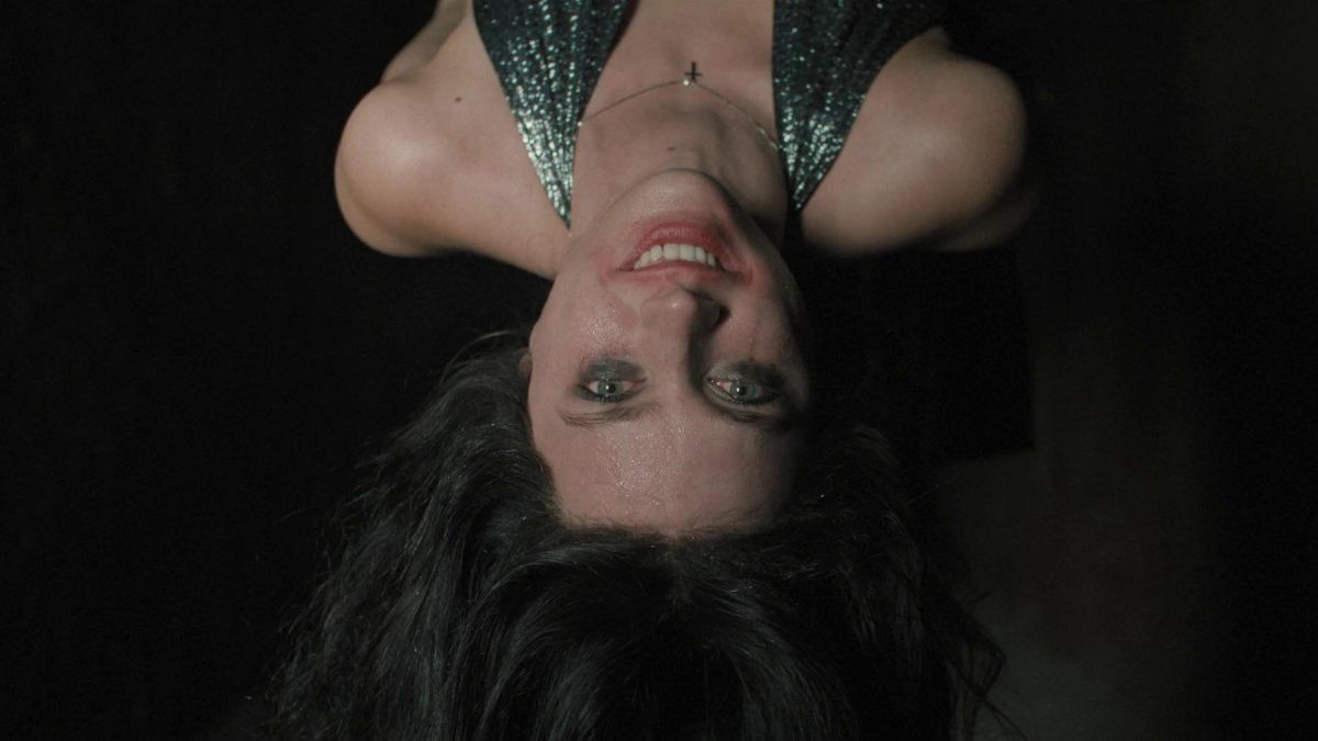 Nell Tiger Free as Margaret in 'The First Omen', hanging upside down