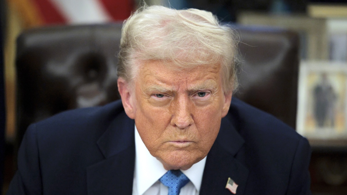 President Donald Trump stares down the camera as he talks to reporters after signing an executive order, "Unleashing prosperity through deregulation," in the Oval Office